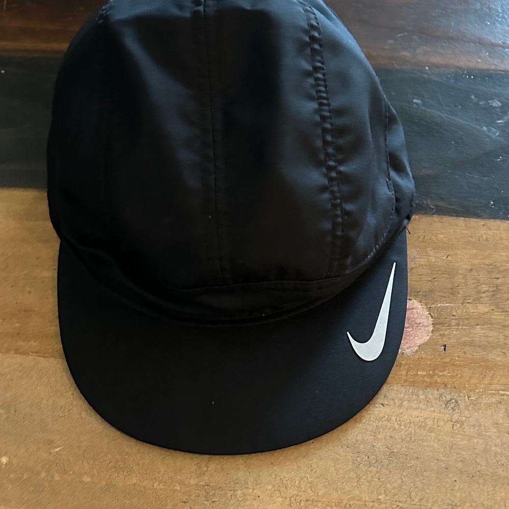 Nike Black Running Cap with Reflective Silver Swoosh & writing on flip up bill.